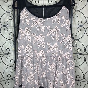 Peplum style tank with blush floral detailing